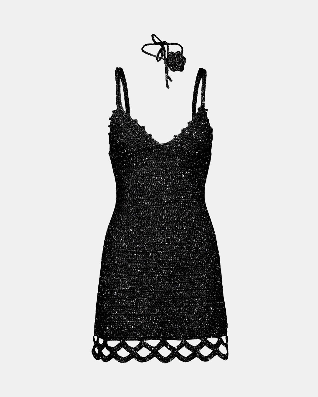 Studio shot of the Apple Pie black crochet mini dress displayed with its matching floral neck choker accessory on a white background.