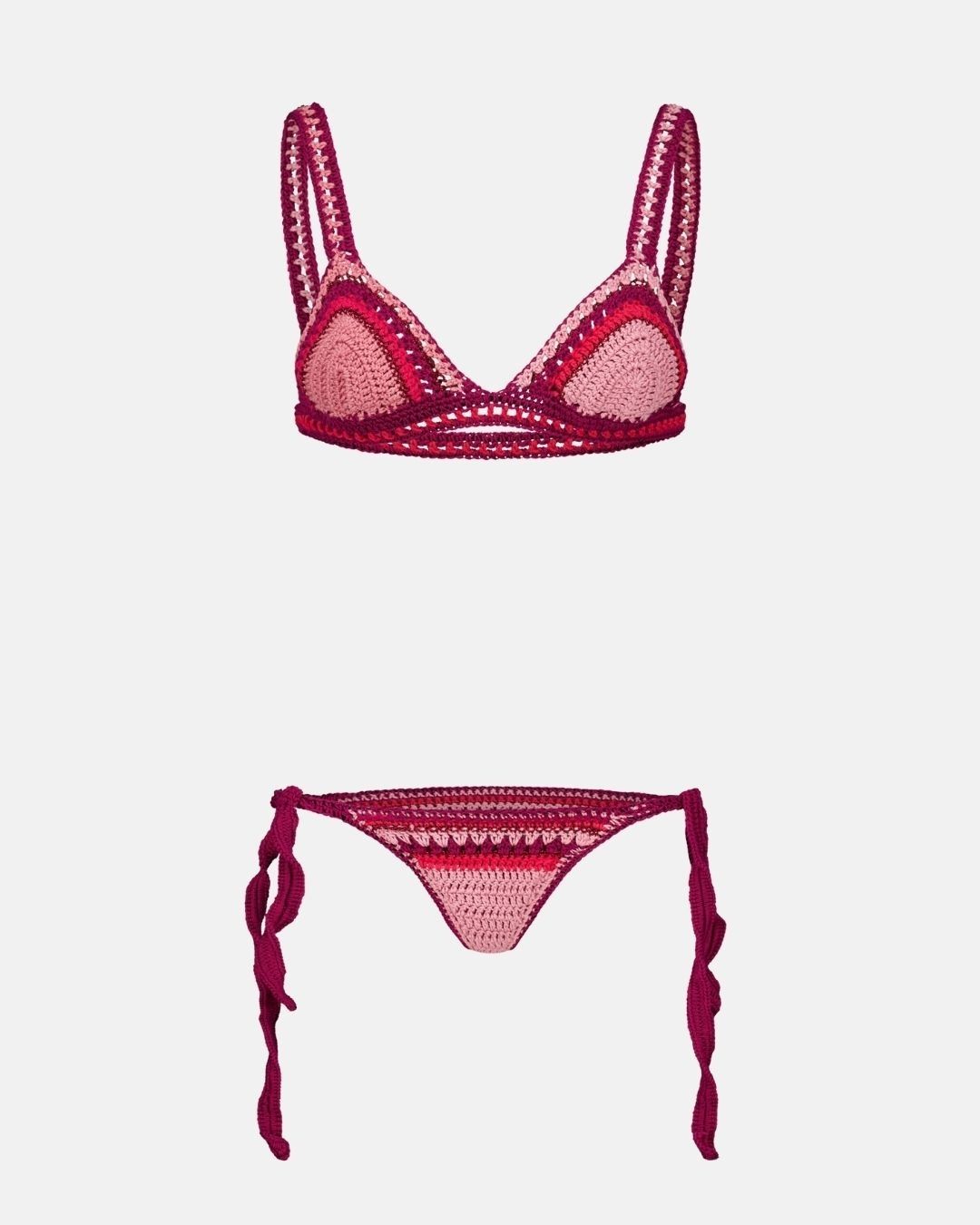 A top-down flat lay view of the Bianca crochet bikini set in shades of cherry red, fuchsia, and pink, showing both the triangle top and the brief bottoms against a white background.