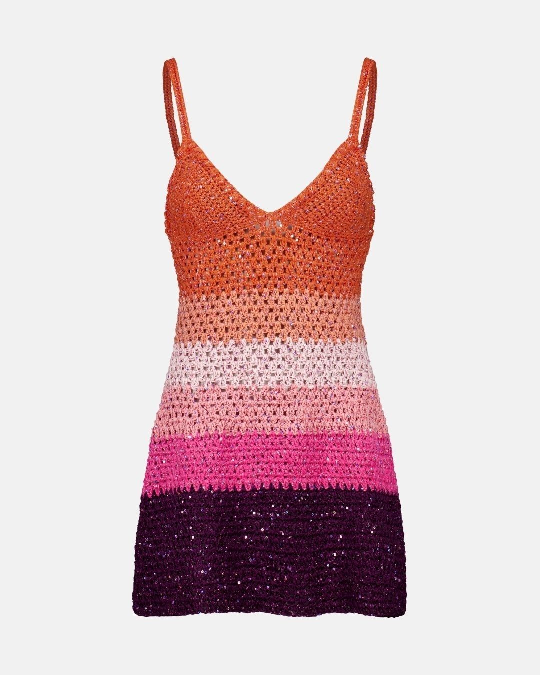 front view of the sienna crochet mini dress with orange and purple sunset gradient on a grey background.
2. Indoor Lifestyle