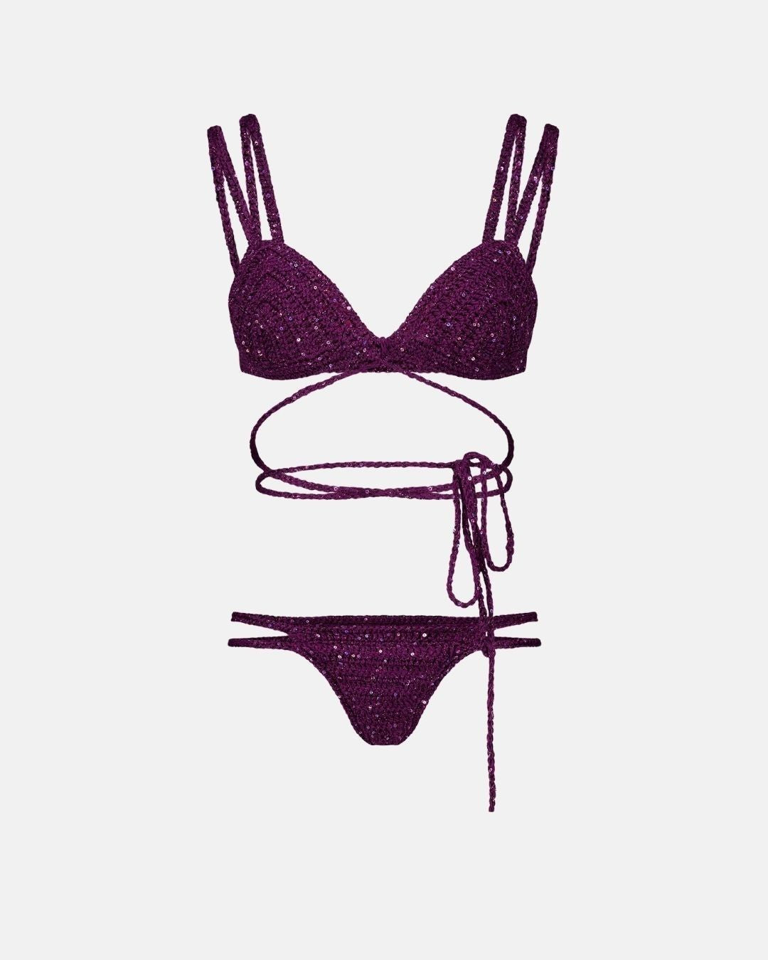 A studio flat lay of the Lila crochet bikini set in deep plum, showing the wrap-around top with long ties and the multi-strap bottoms.
