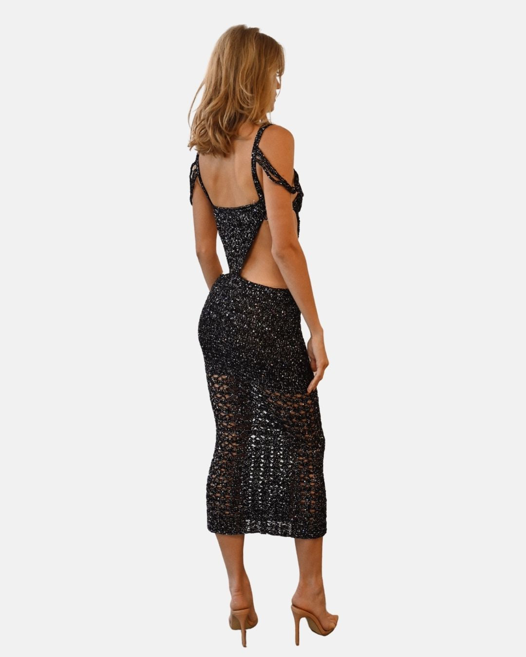 Back and side view of the Melissa maxi dress, showcasing the open-back design, the delicate shoulder straps, and the sheer crochet detailing at the hem.